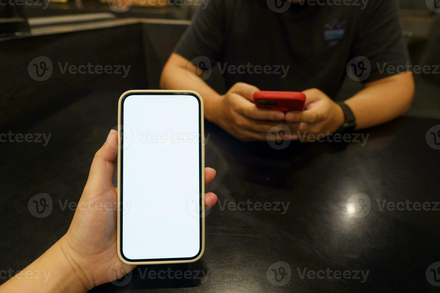Close up of women's hands holding cell telephone blank copy space screen. smart phone with technology concept photo
