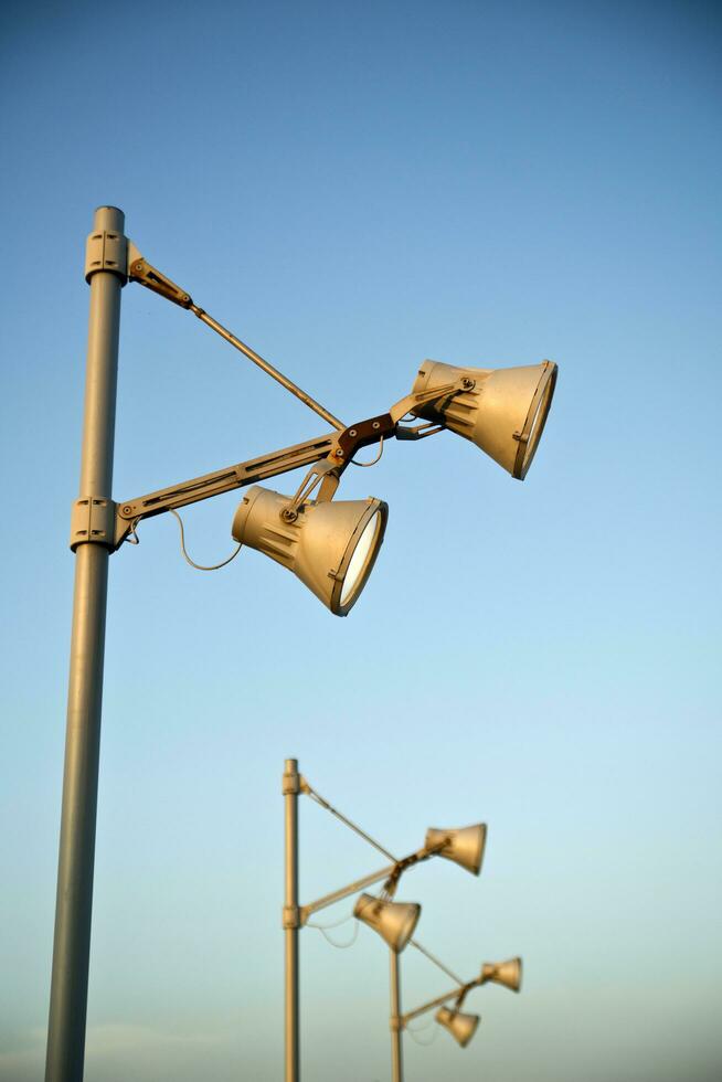 a group of street lights are on a pole photo