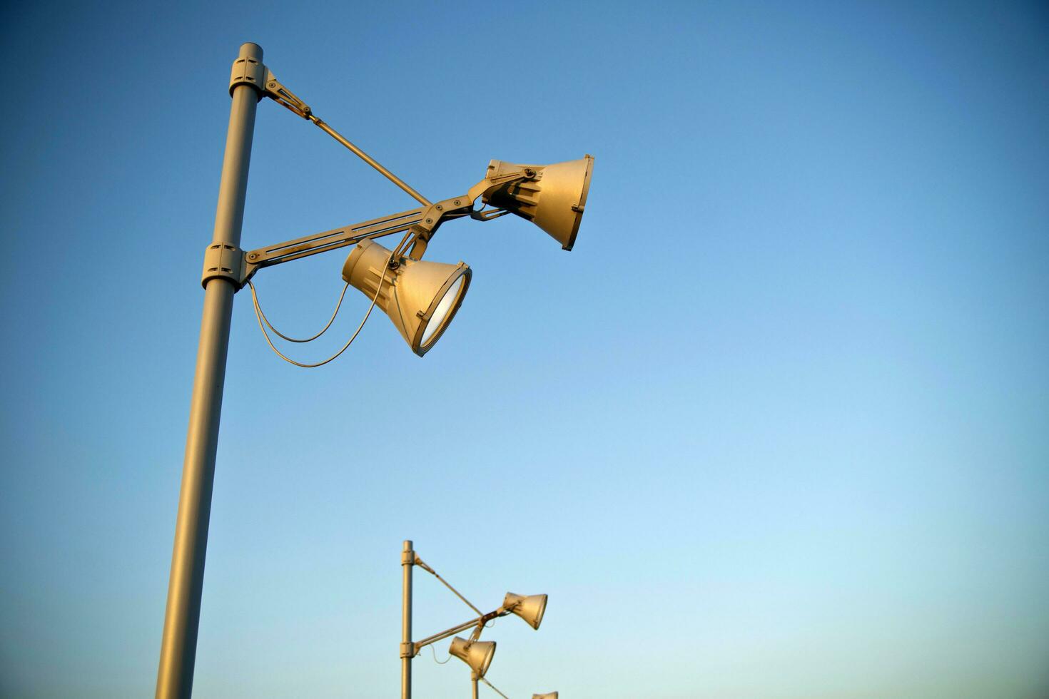a group of street lights are on a pole photo