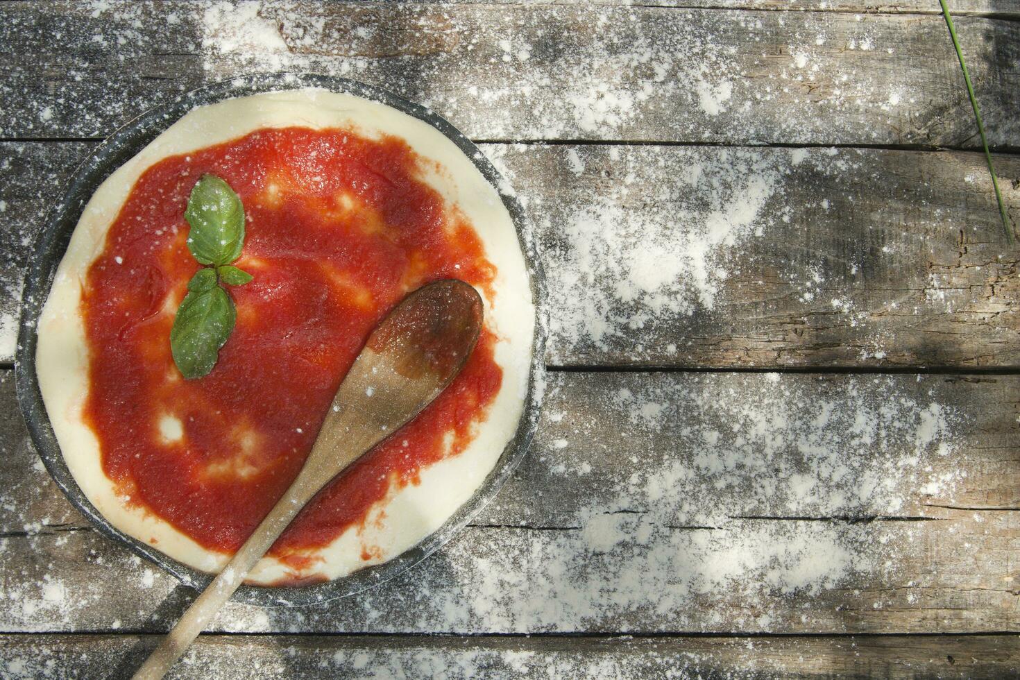 Raw pizza base photo