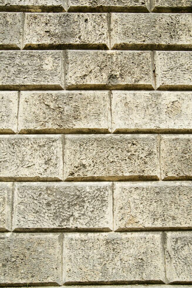 a close up of a brick wall with a few squares photo