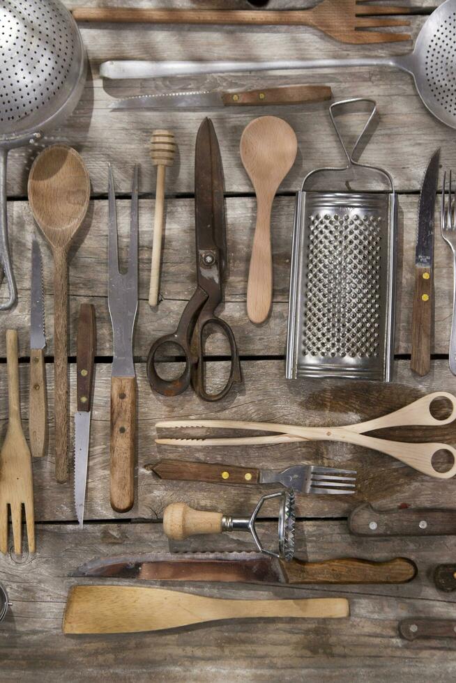 a bunch of different utensils on a table photo