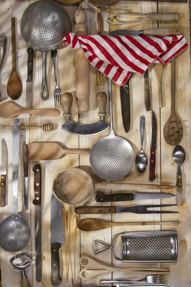 a bunch of different utensils on a table photo