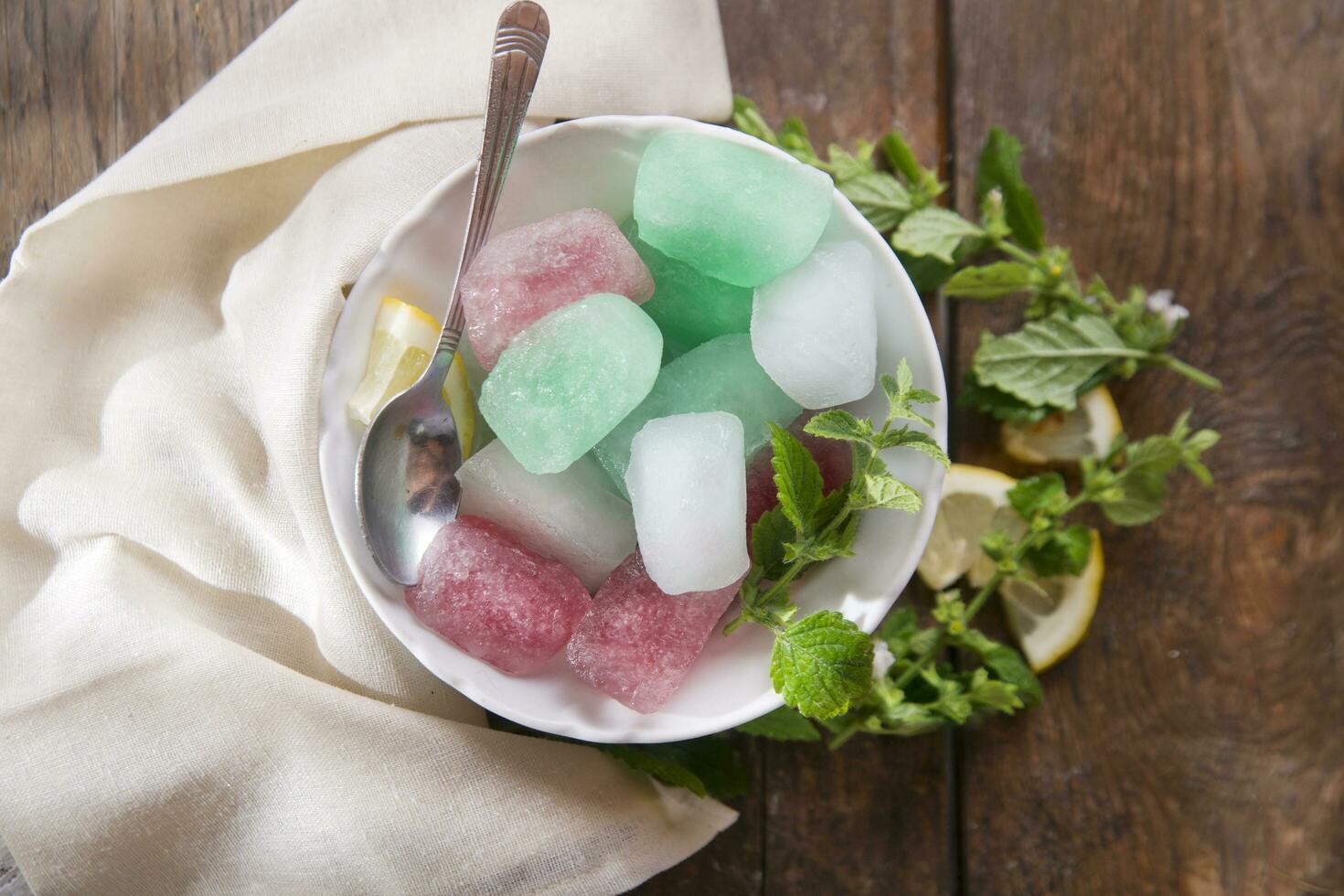 Bowl of colored ice-cubes photo