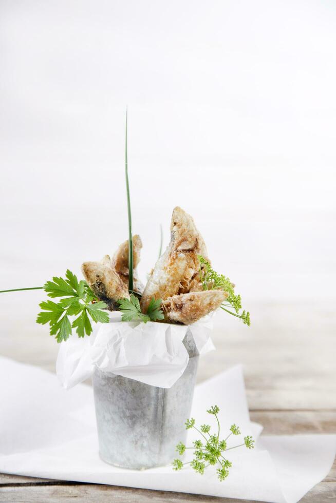 a plate of fish with a fork and knife on it photo