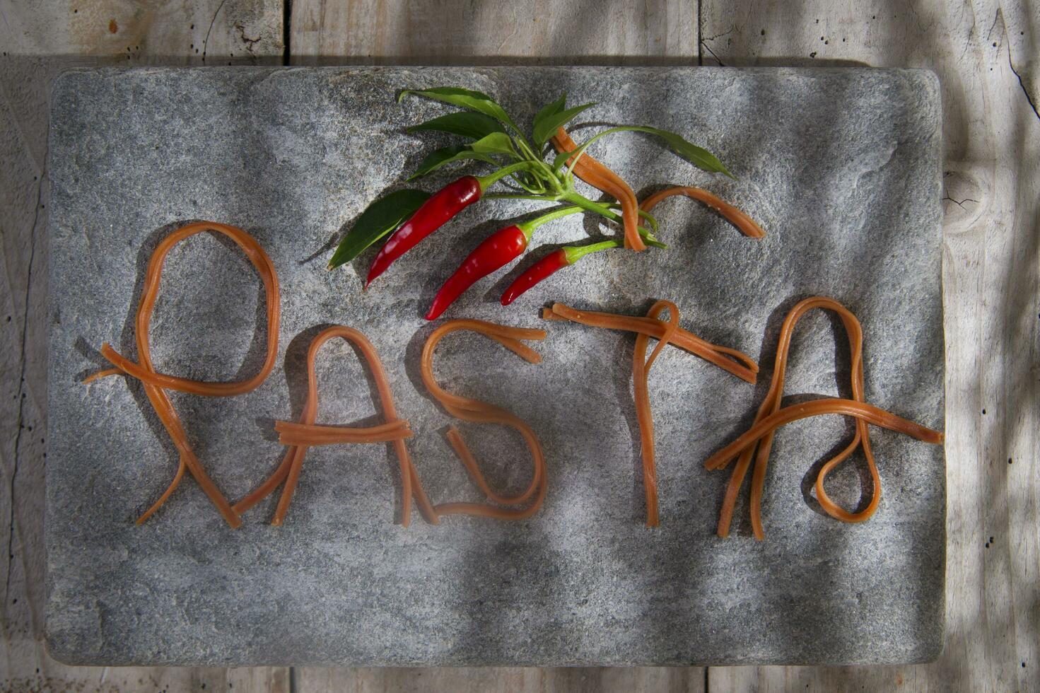 Pasta on a stone for advertising photo
