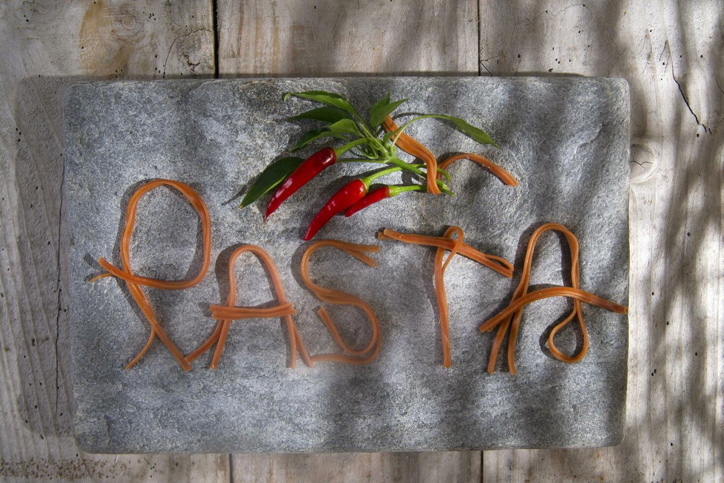 Pasta on a stone for advertising photo