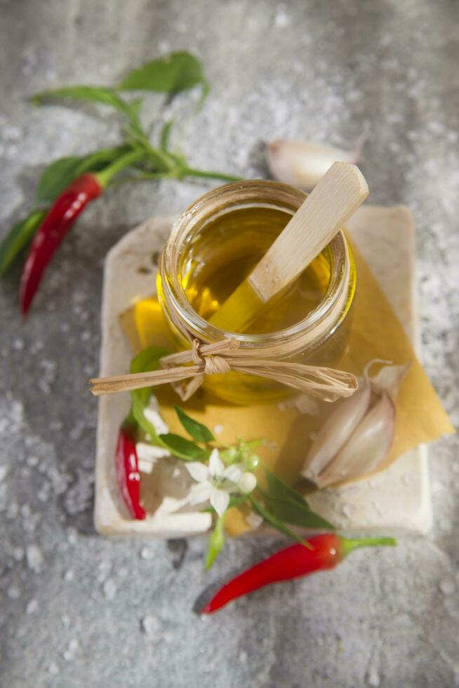 Olive oil, garlic and chili photo