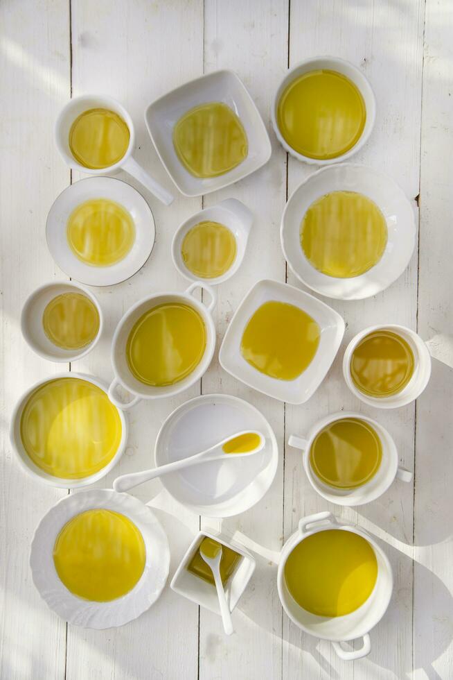 Small containers with extra virgin olive oil photo