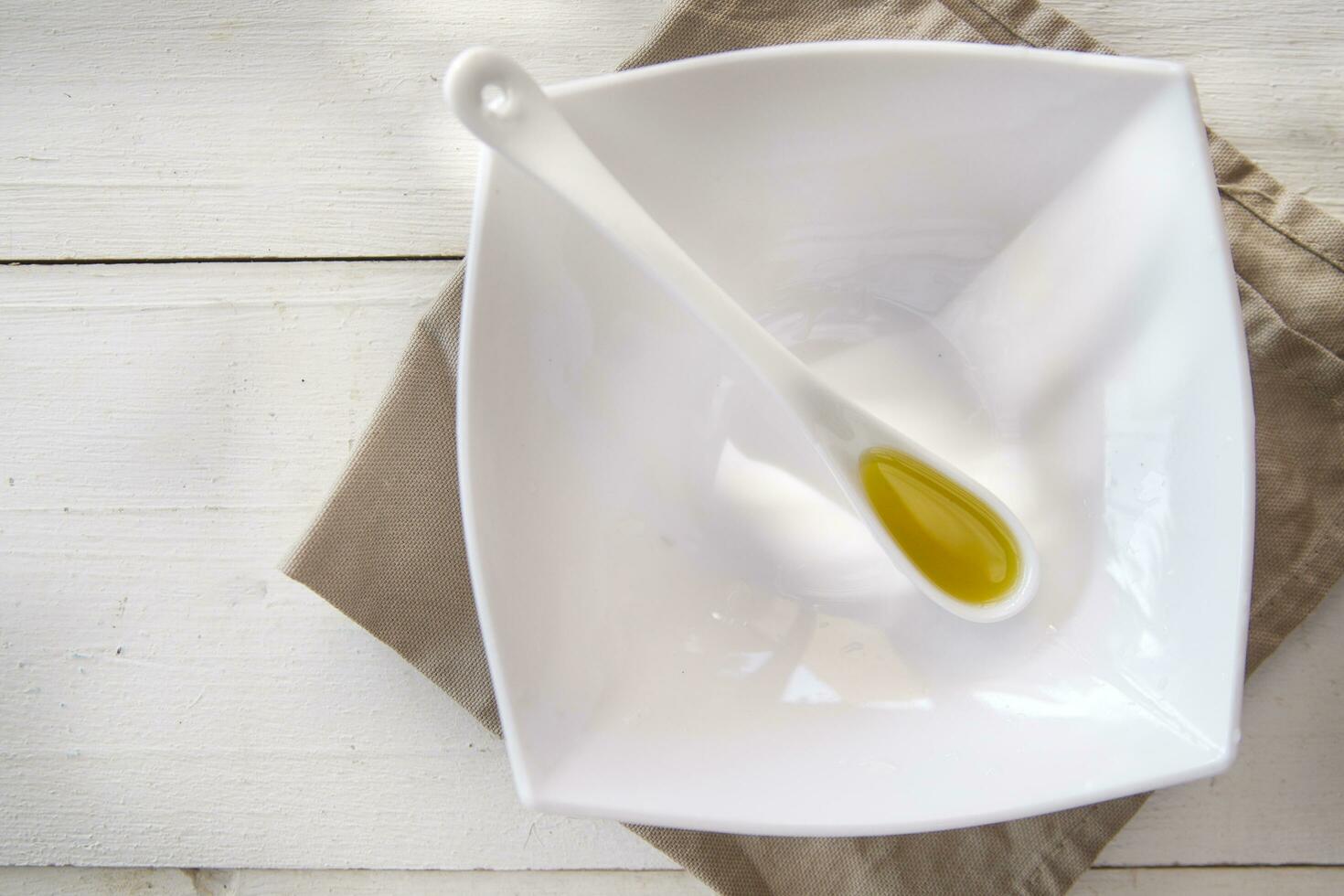 Small containers with extra virgin olive oil photo