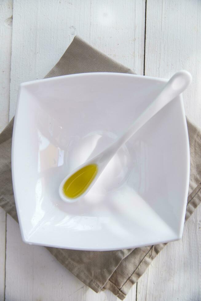 Small containers with extra virgin olive oil photo