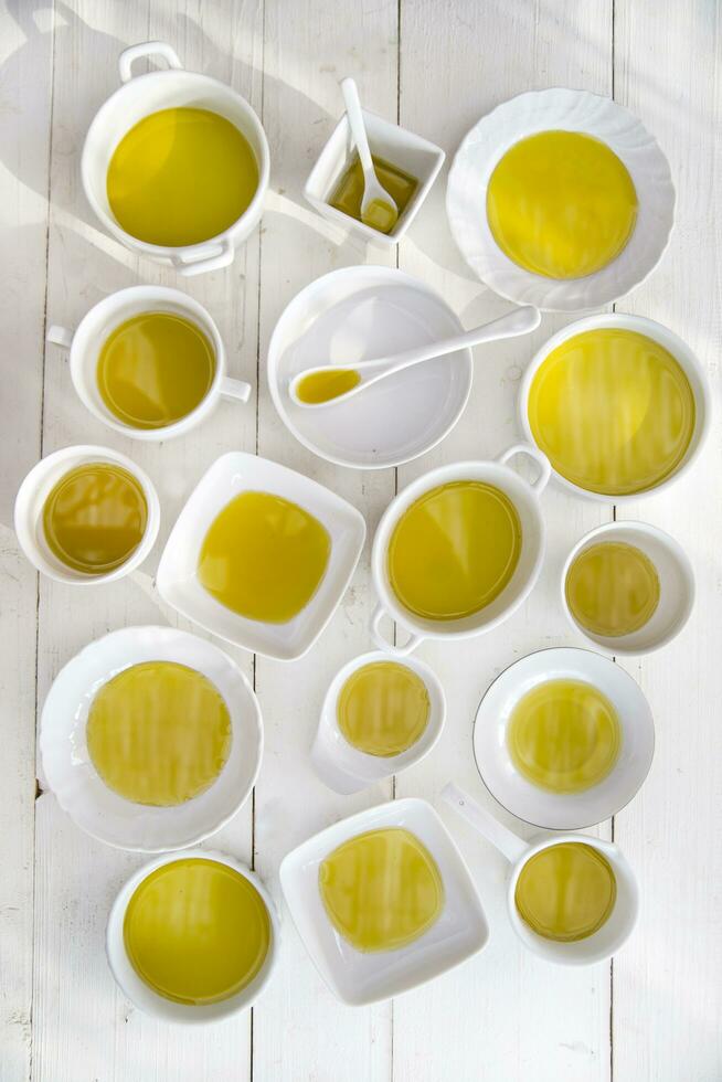 Small containers with extra virgin olive oil photo