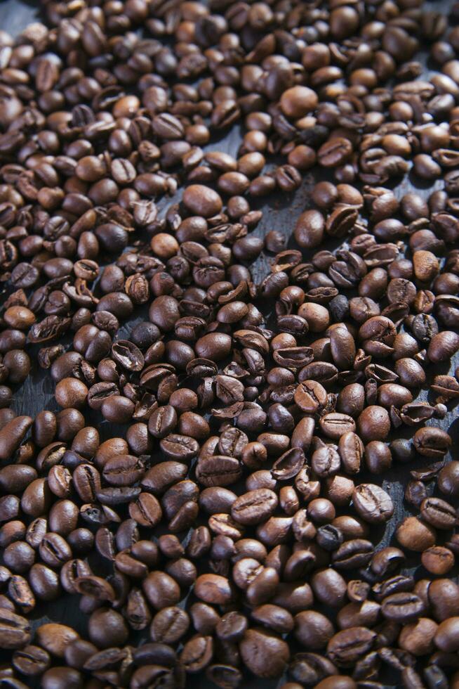 coffee beans on a dark wooden table photo