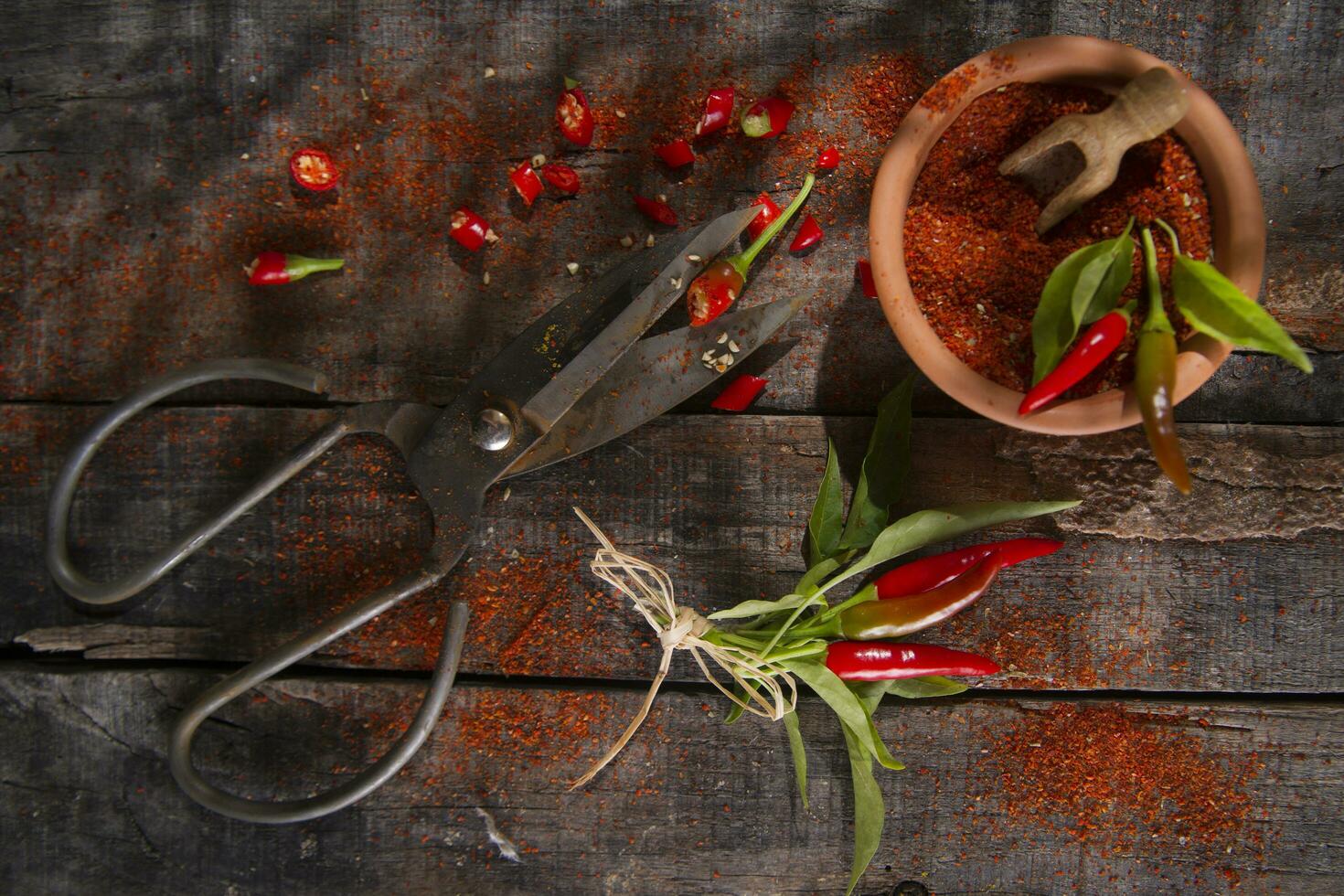 a pair of scissors and a bunch of chili peppers photo