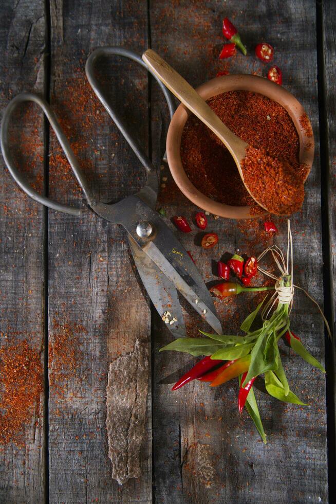 a pair of scissors and a bunch of chili peppers photo