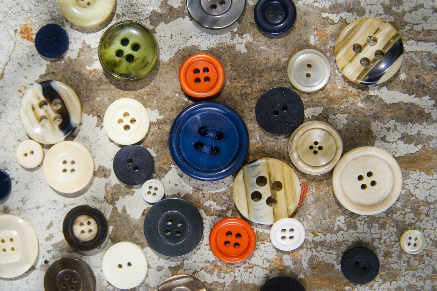 a pile of buttons on a table photo