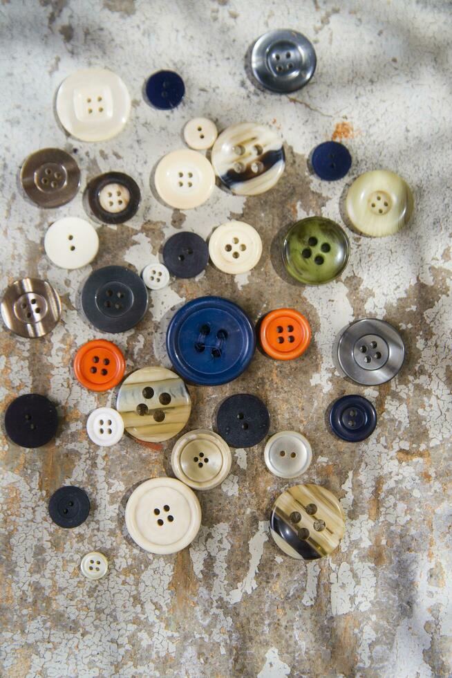 a pile of buttons on a table photo