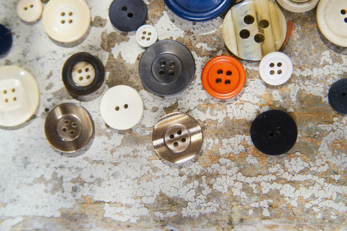 a pile of buttons on a table photo