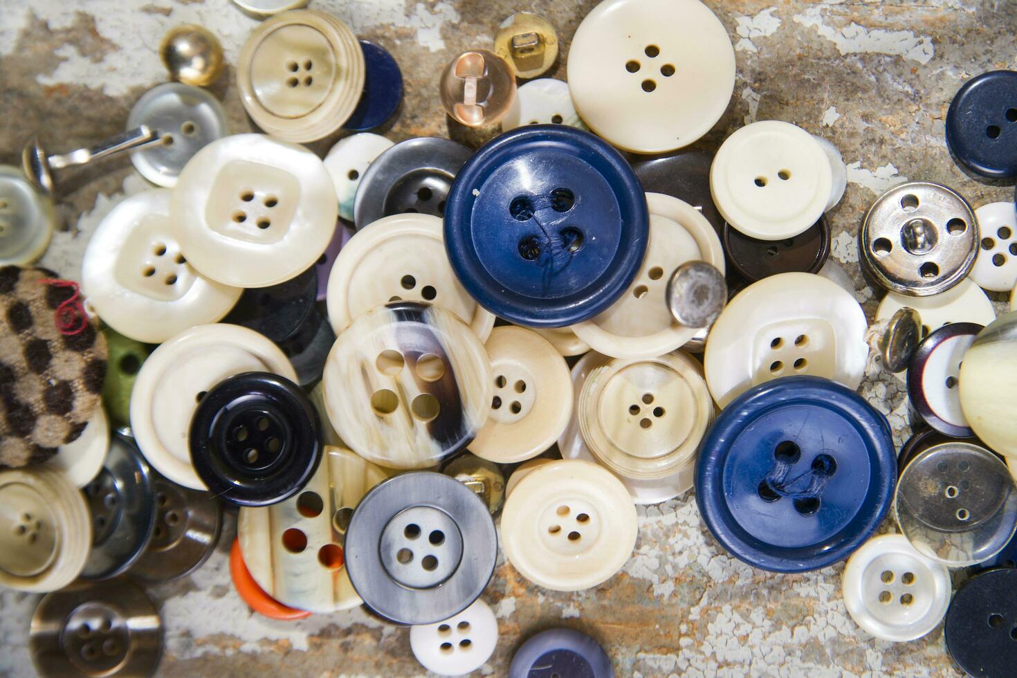 a pile of buttons on a table photo