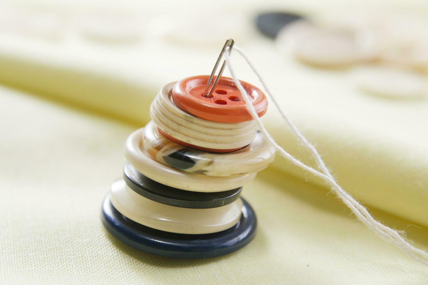 a pile of buttons on a table photo