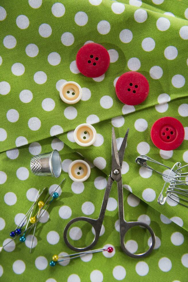 a pile of buttons on a white table photo