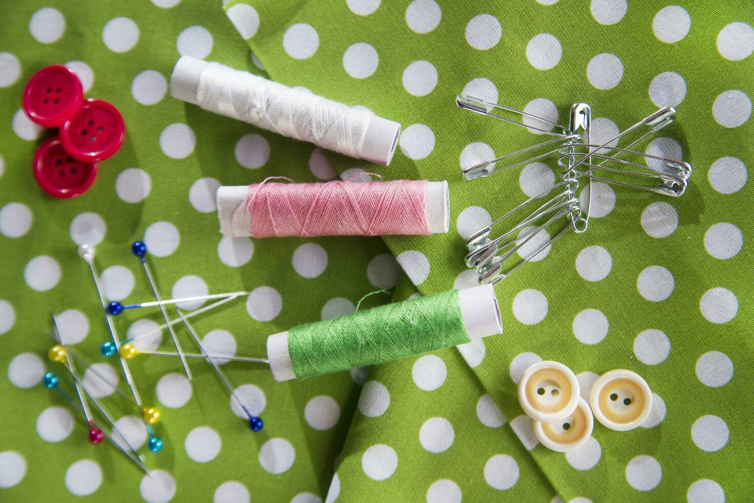 a pile of buttons on a white table photo