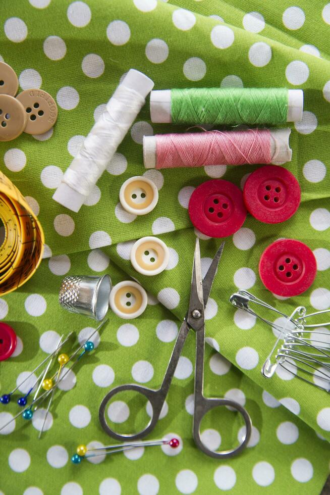 a pile of buttons on a white table photo