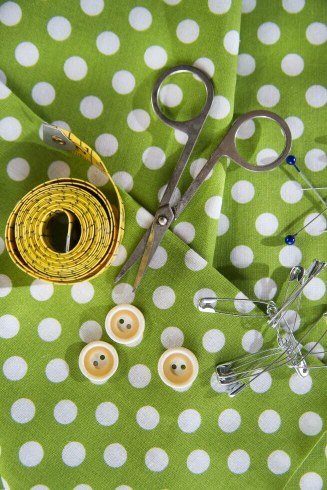 a pile of buttons on a white table photo