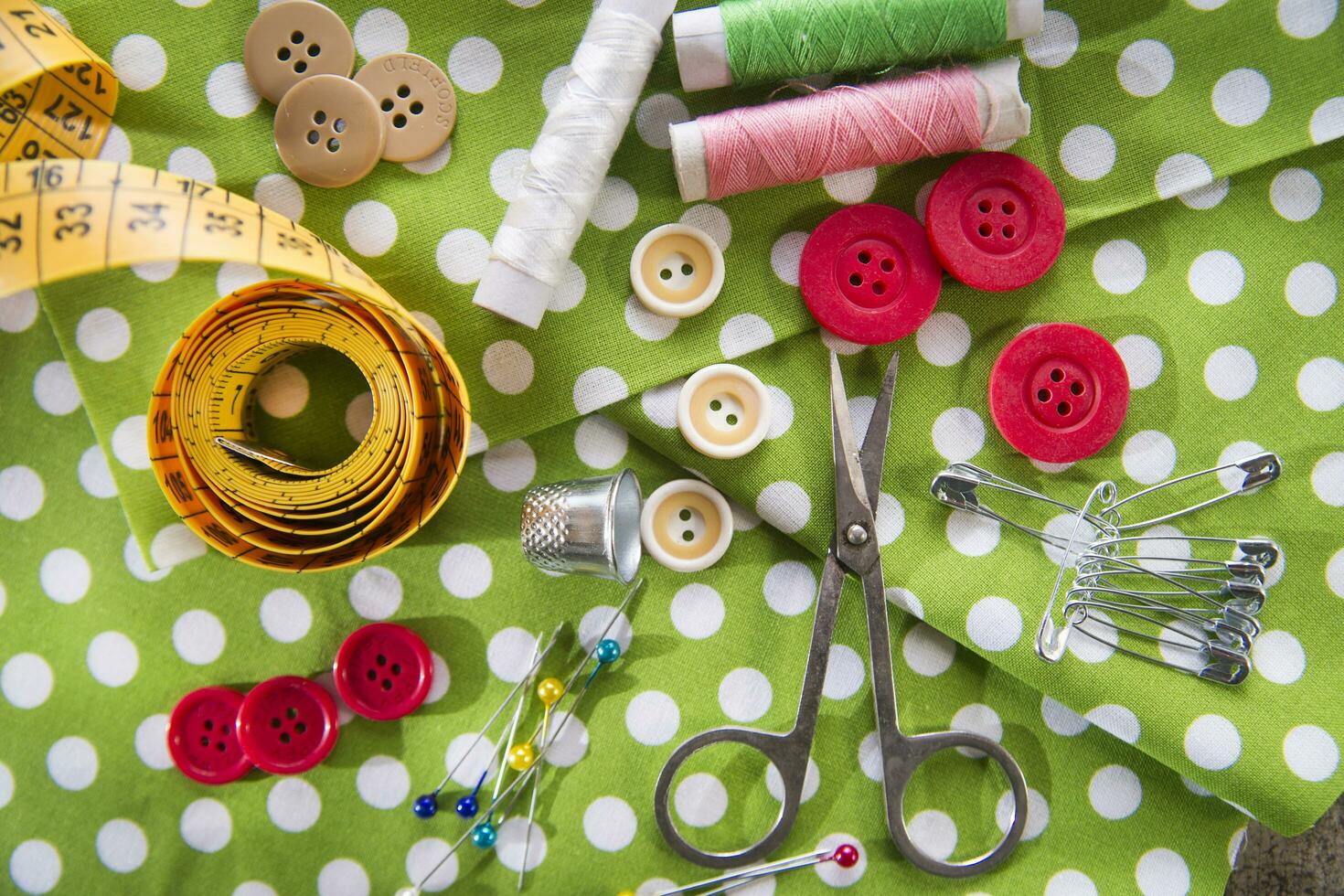 a pile of buttons on a white table photo