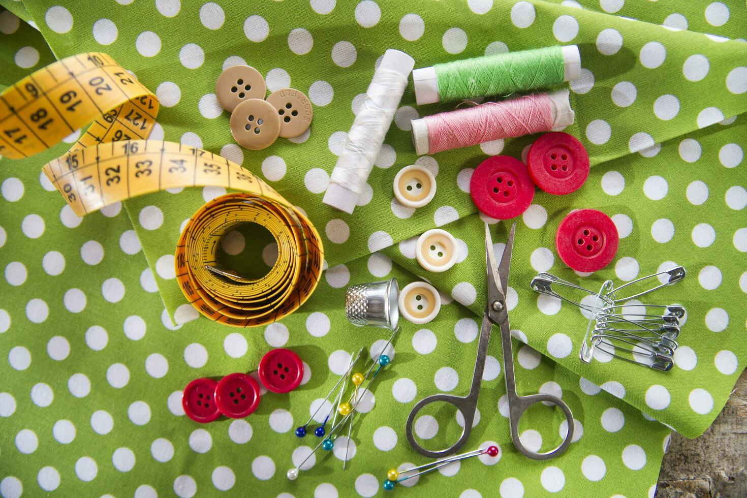 a pile of buttons on a white table photo