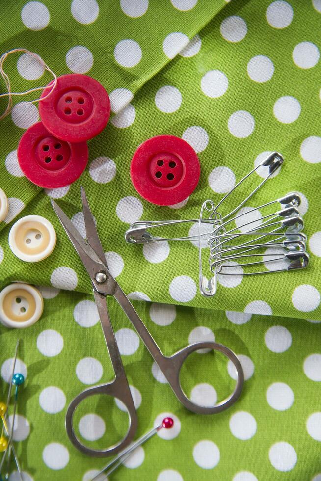 a pile of buttons on a white table photo
