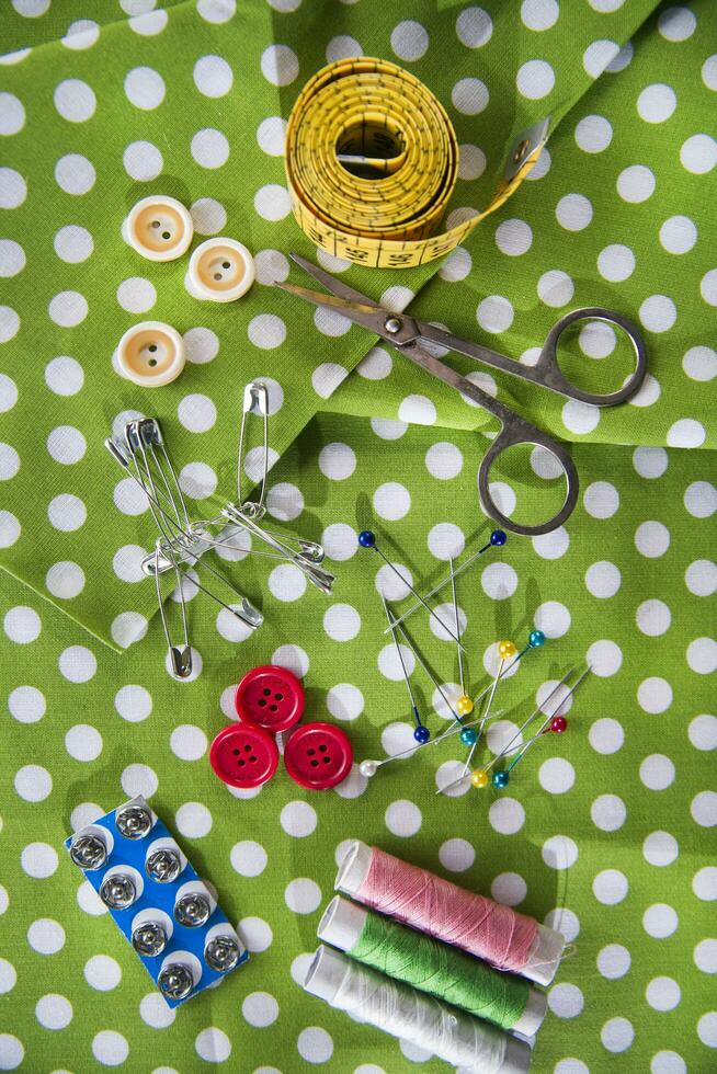 a pile of buttons on a white table photo