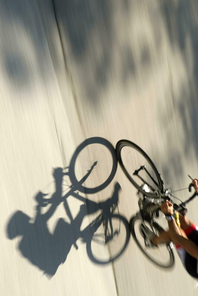 a man riding a bike photo
