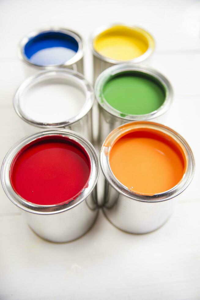 a group of paint cans with different colors photo