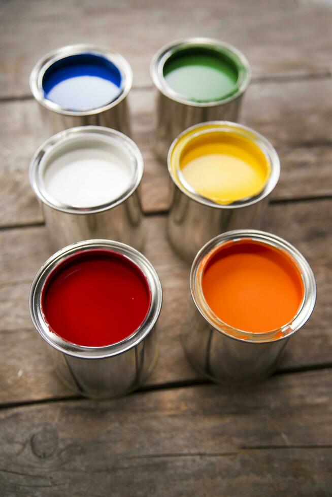 a group of paint cans with different colors photo