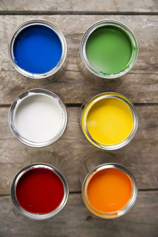 a group of paint cans with different colors photo