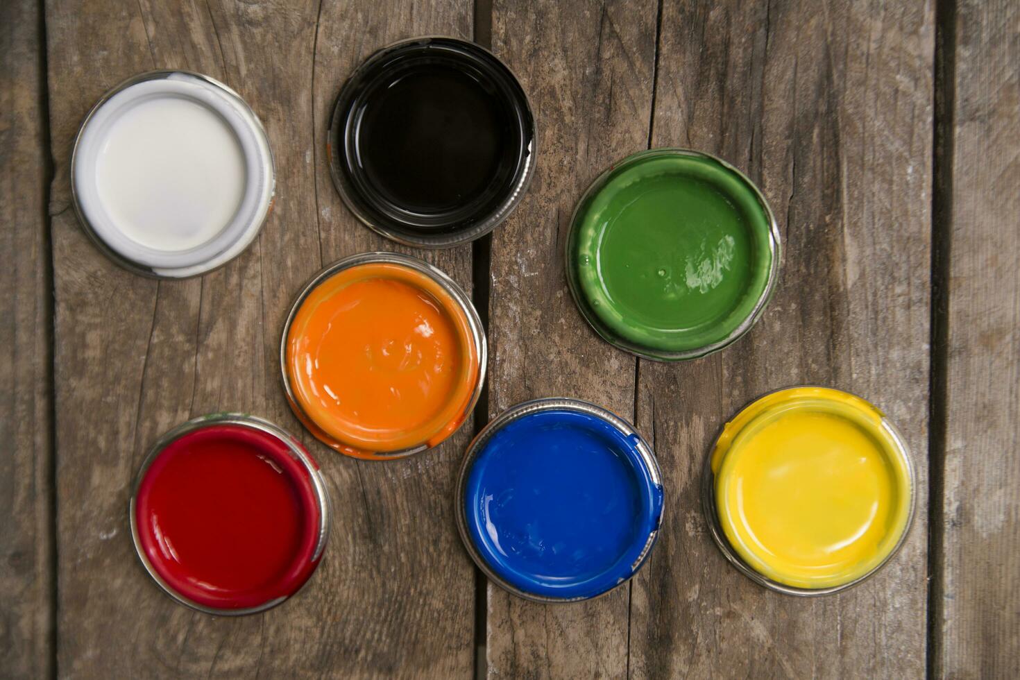 a group of paint cans with different colors photo