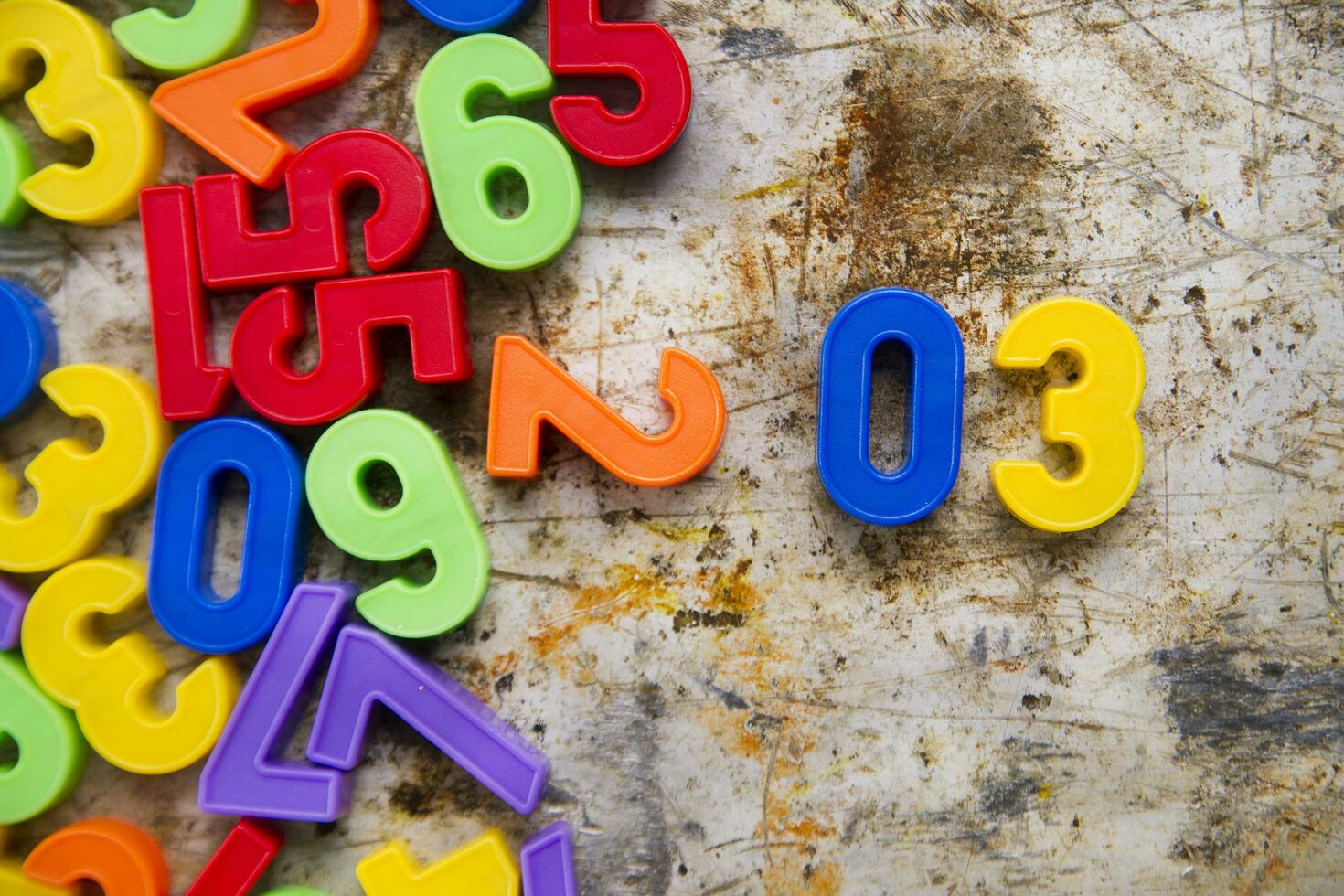 colorful plastic numbers on a white background photo