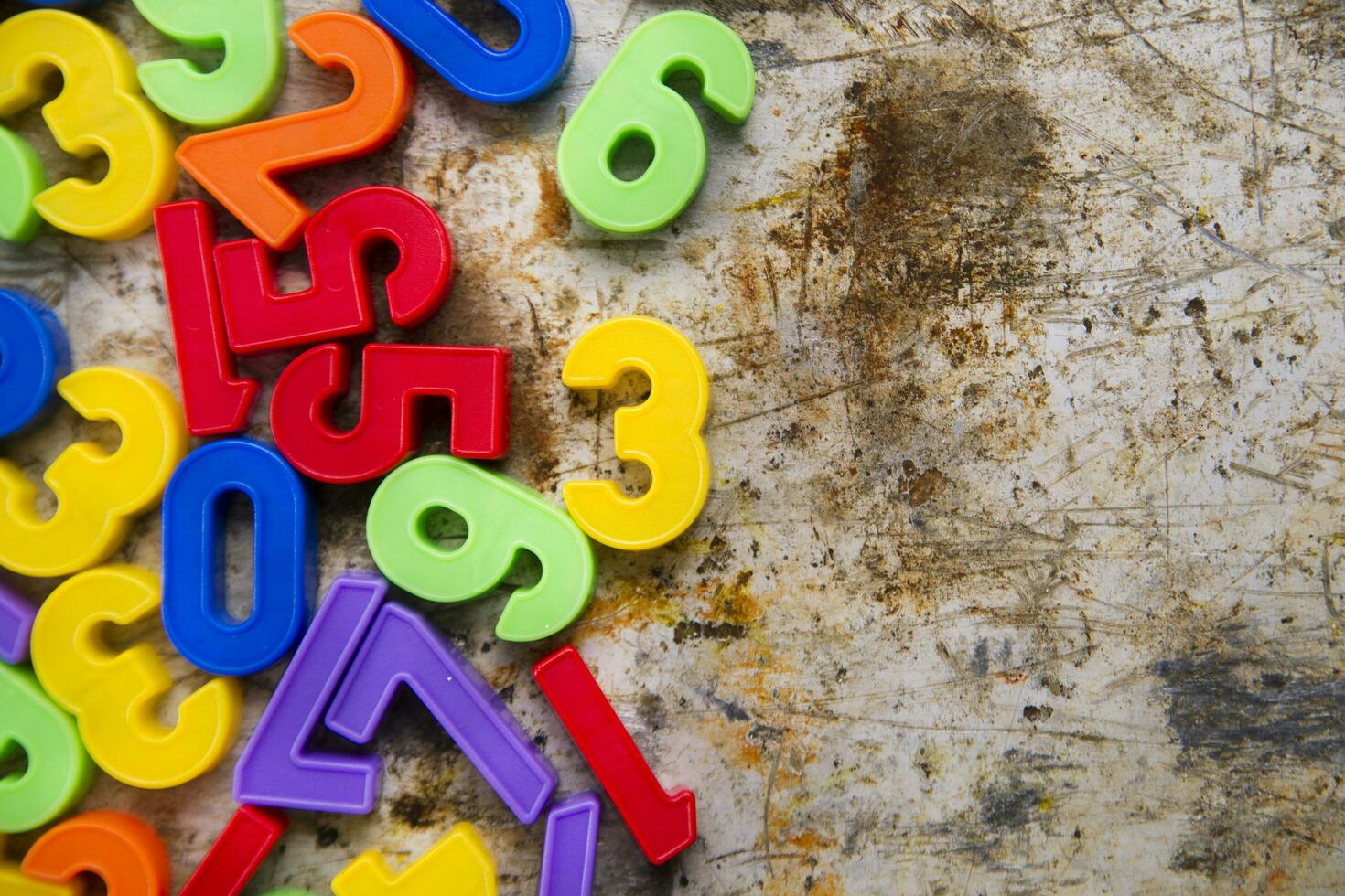 colorful plastic numbers on a white background photo