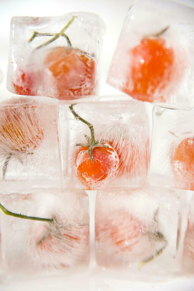 ice cubes with tomatoes on top photo