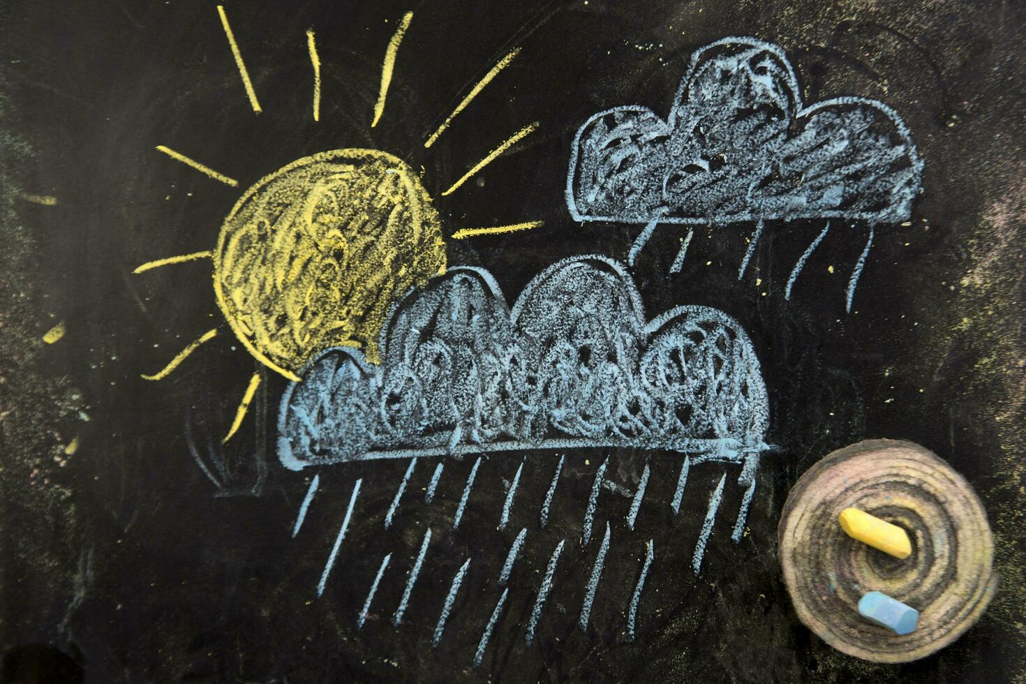 a chalk drawing of a cloud and snow on a blackboard photo