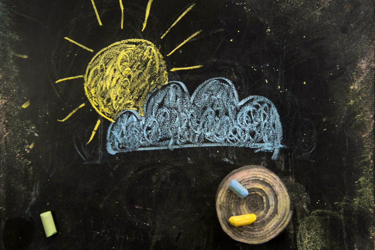 a chalk drawing of a cloud and snow on a blackboard photo