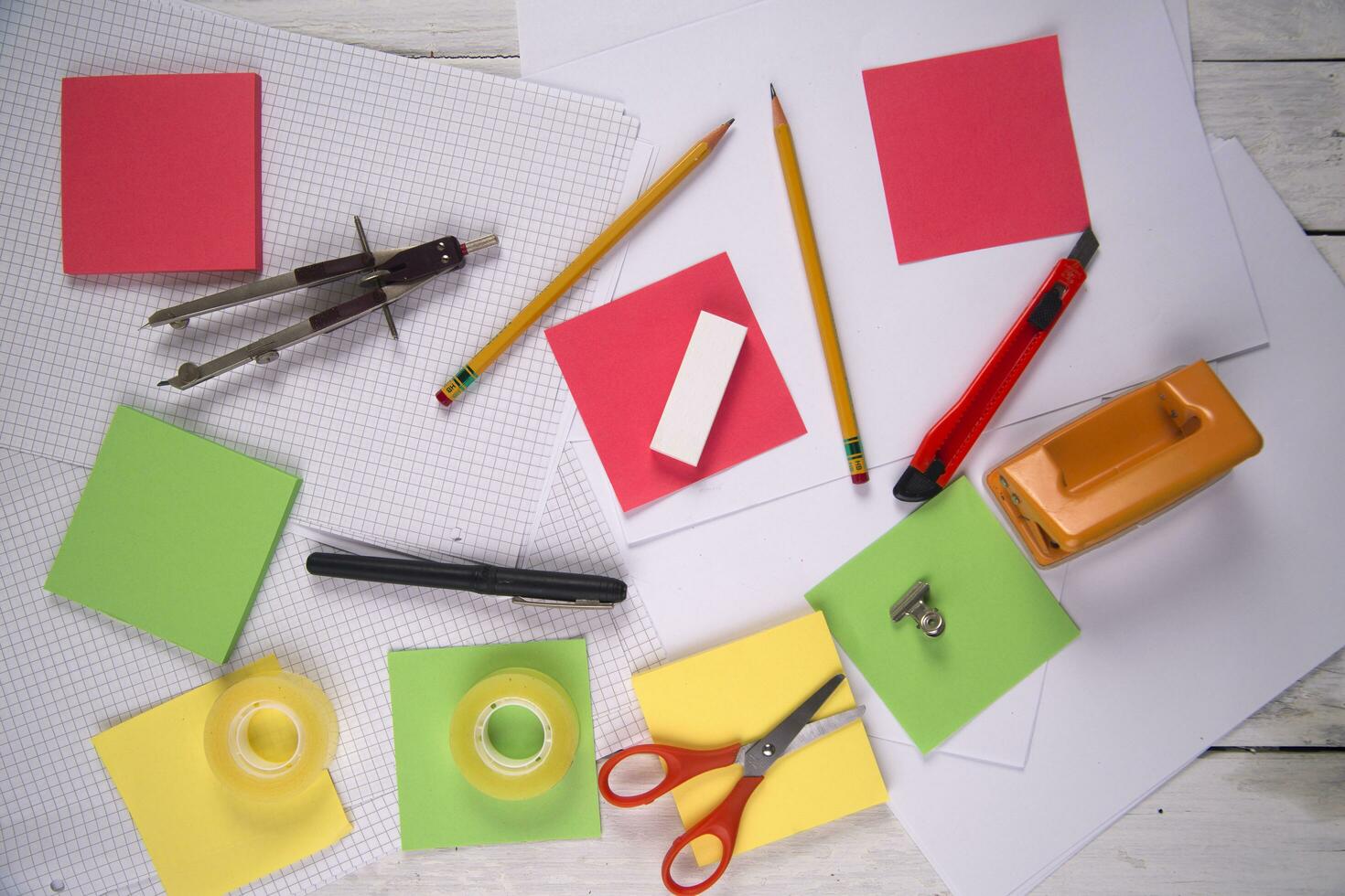 a table with a bunch of different colored paper photo