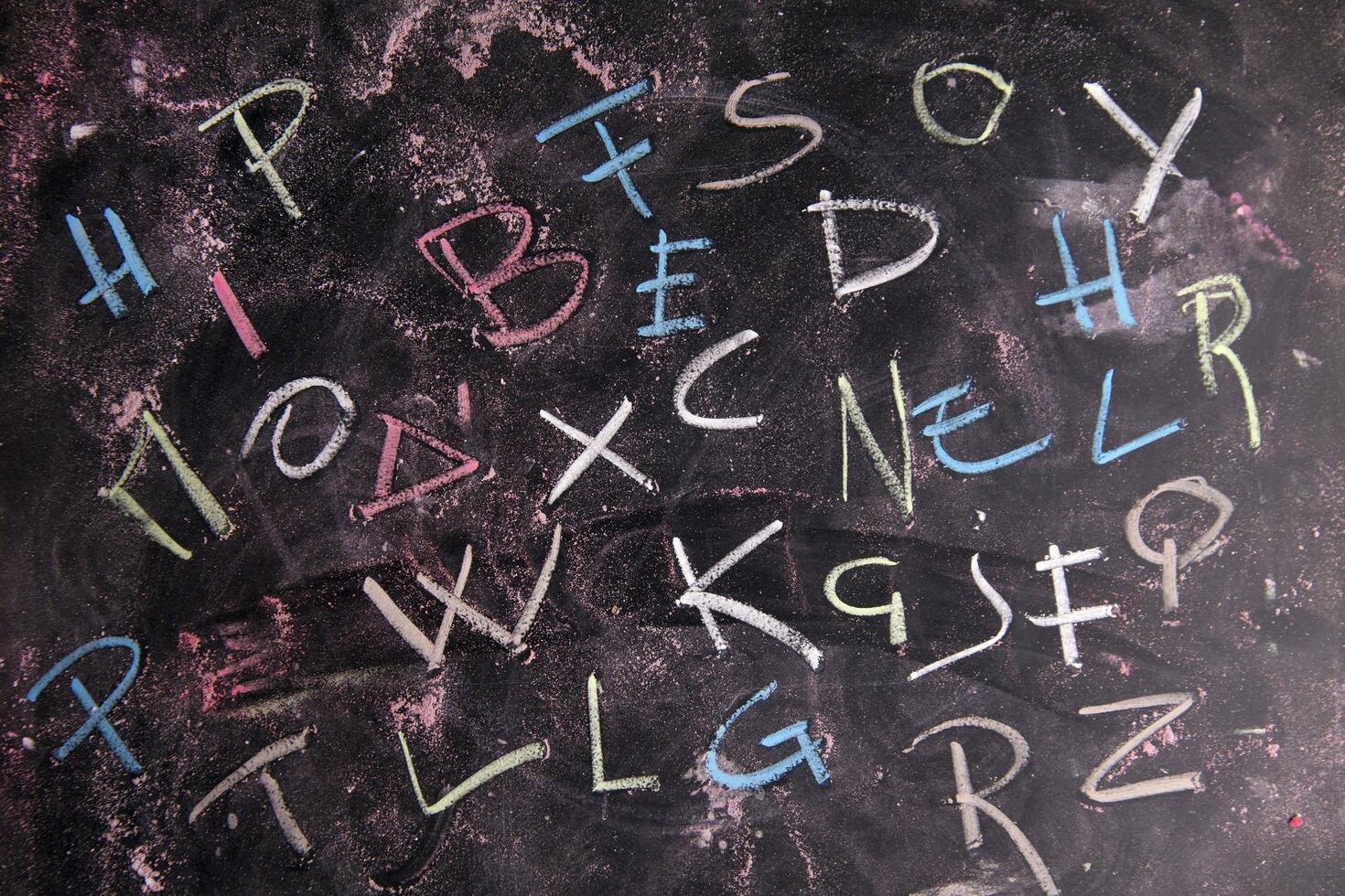 a chalkboard with letters written on it photo