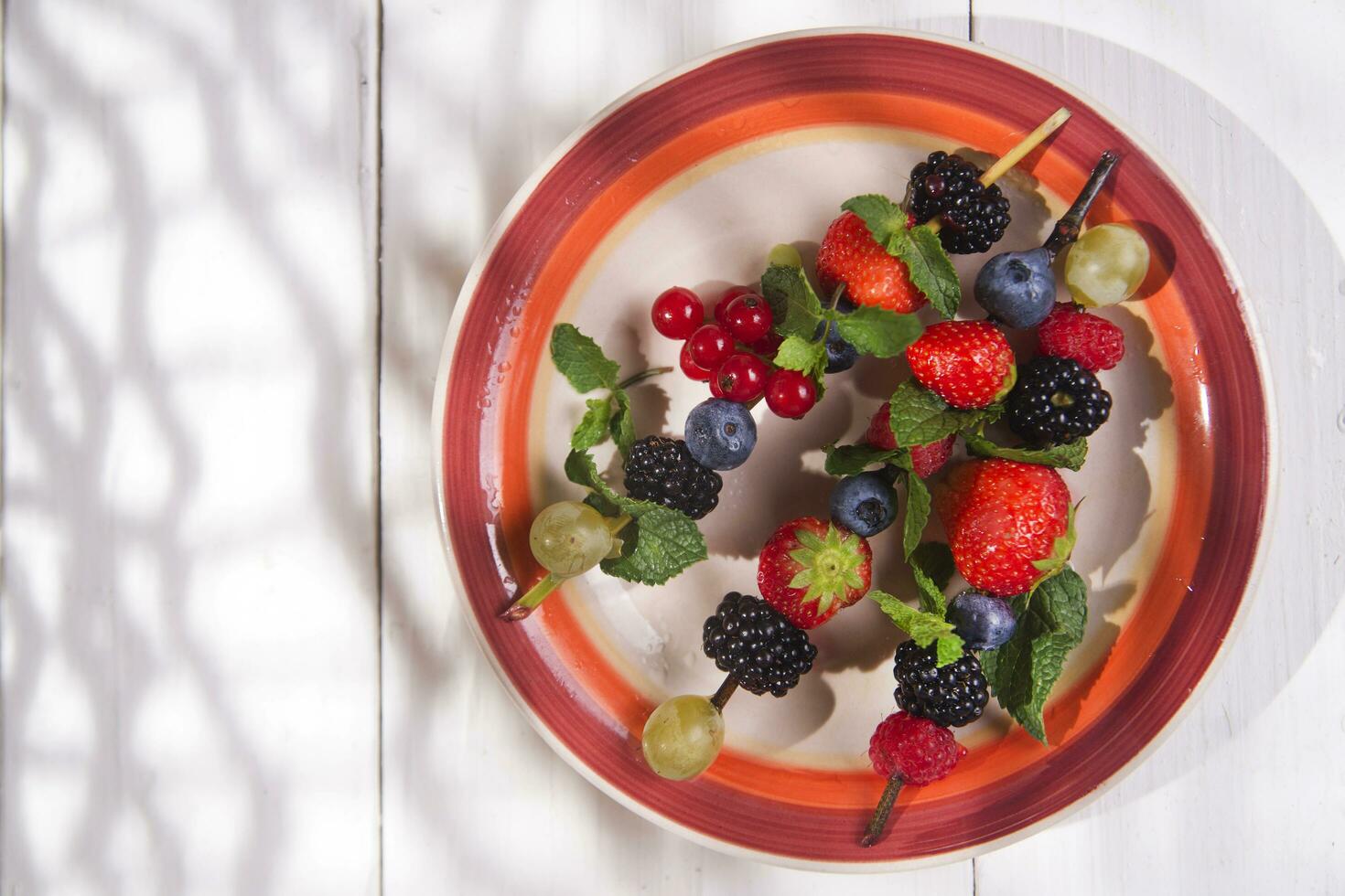 Skewer of berries in pot photo
