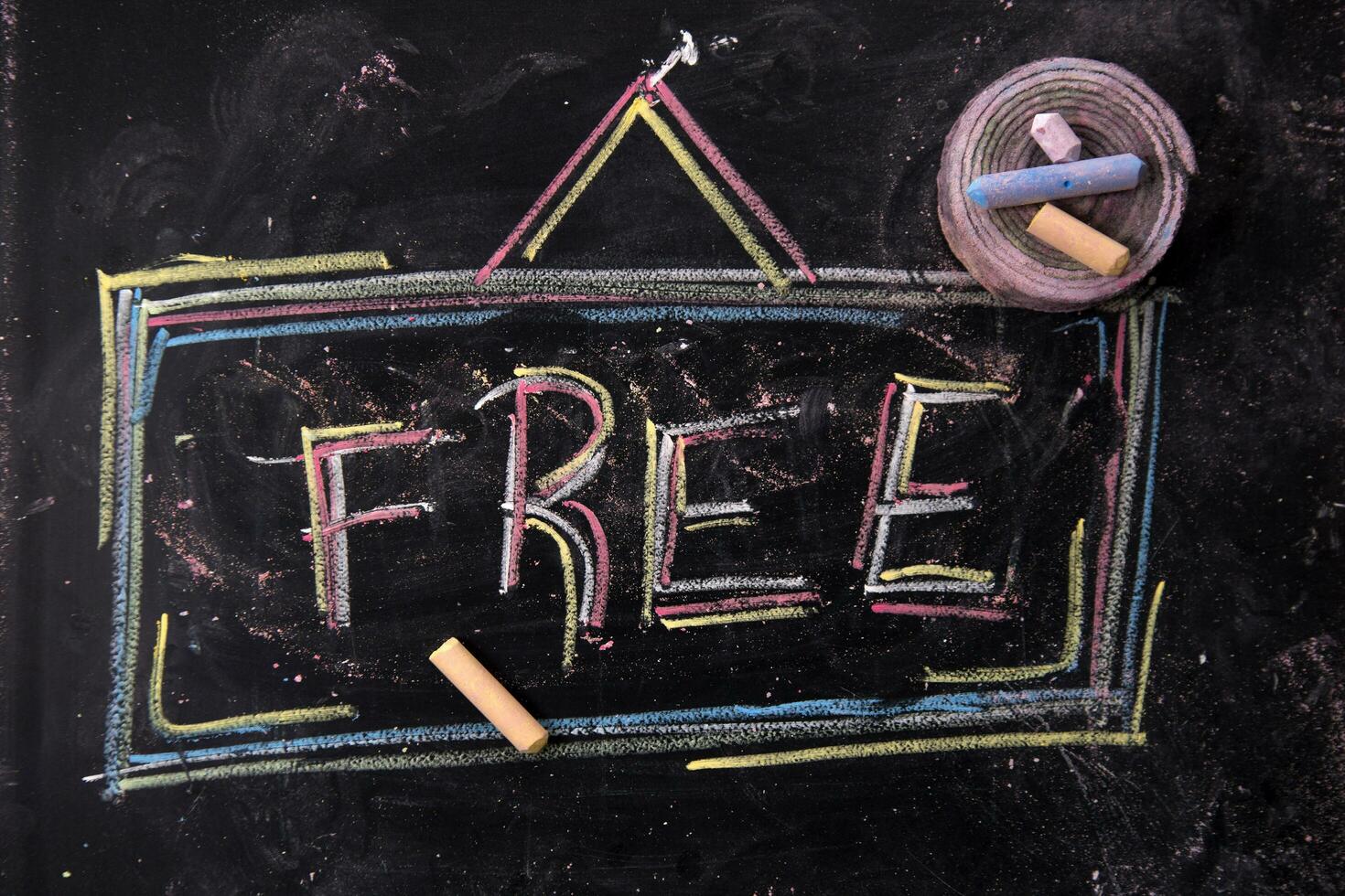 a chalkboard with the word free written on it photo