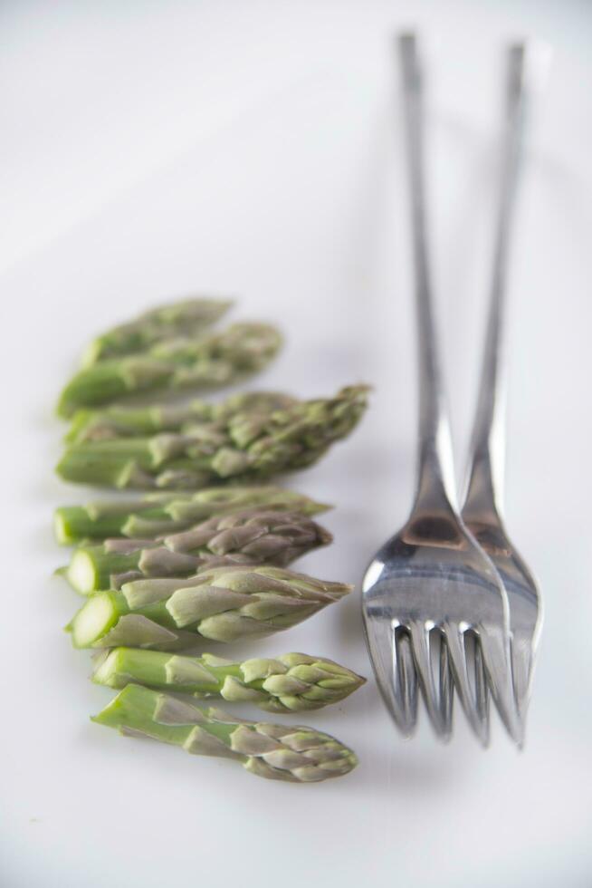 Raw asparagus tips photo