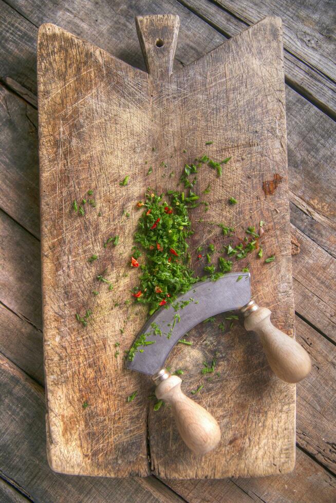 Chopped chives and chili peppers photo