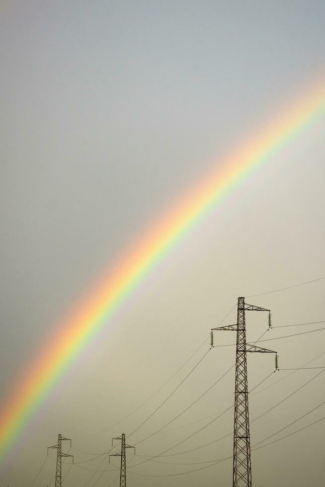 Rainbow through power line photo
