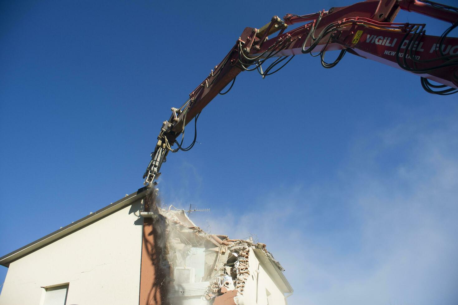 The controlled demolition of a house photo